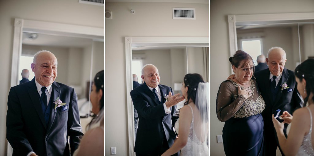 A dad and mom and seeing their daughter for the first look on her wedding day.