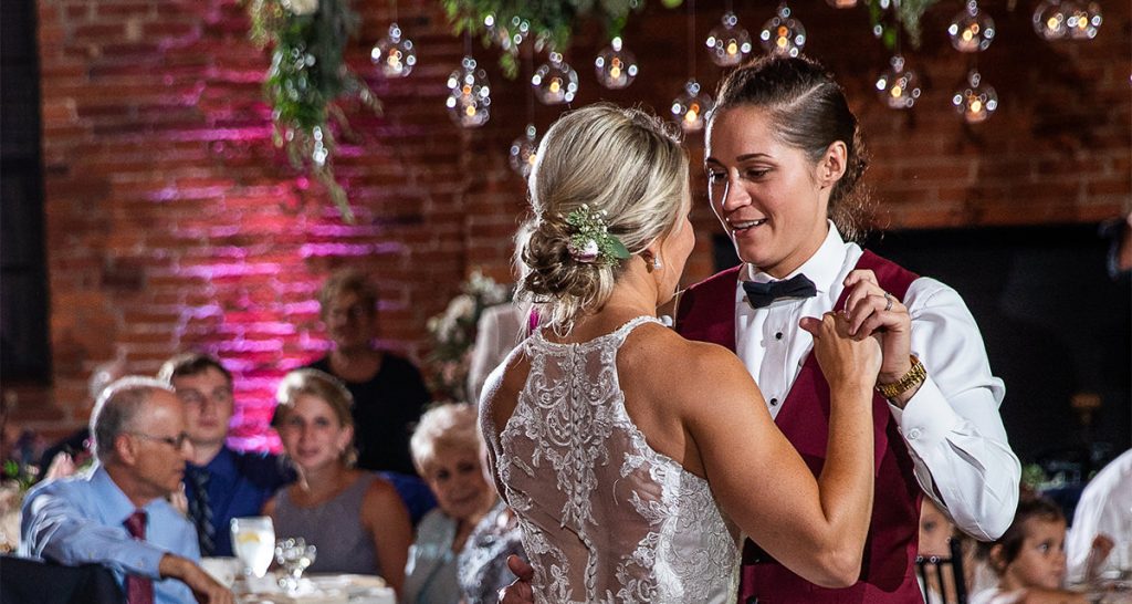 Two brides doing a first dance at their wedding to a favorite song