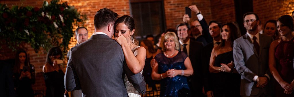 A bride and groom dancing at their wedding reception