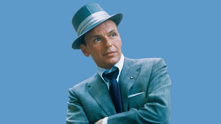 frank sinatra posing in a hat. This is the cover photo for an article called frank sinatra wedding songs.