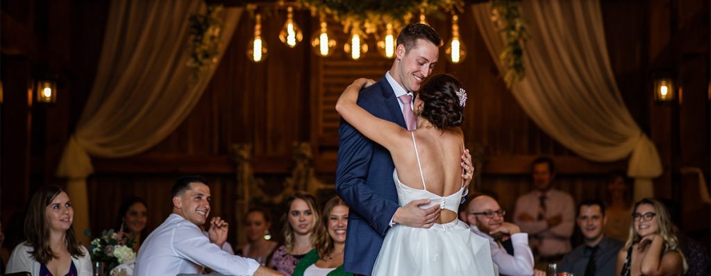 A bride and groom dancing to their favorite song at the wedding reception