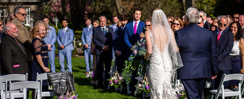 A bride doing the bridal processional at her wedding to one of her favorite songs.