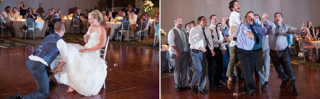 A funny song is playing during the garter removal. This photo shows a groom removing the garter and a bunch of single guys trying to catch it after the groom tossed it to them.