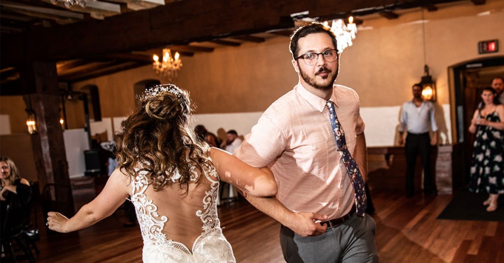 A bride dancing with her brother at the wedding