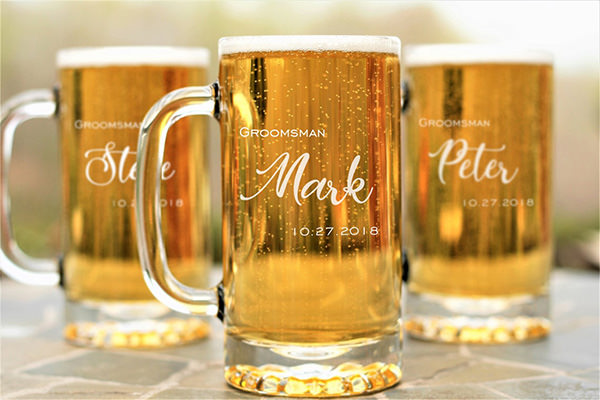 3 engraved beer mugs sitting on a table