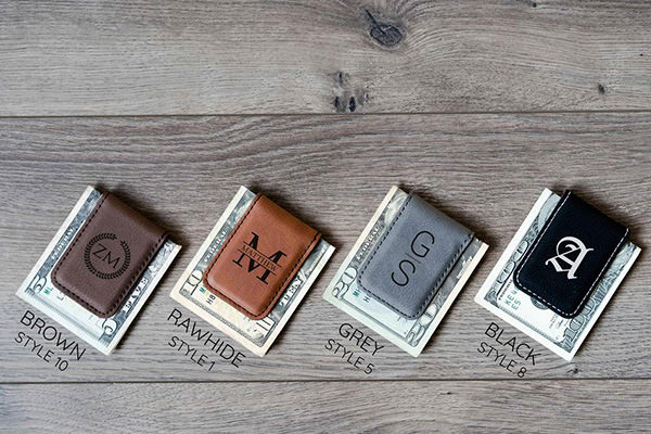 4 money clips sitting on a table