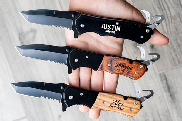 3 pocket knives that are gifts for groomsmen. They are engraved.