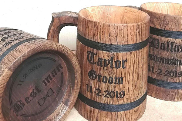 cool wooden beer mug used for groom or groomsmen gift. The photo shows 3 of them.
