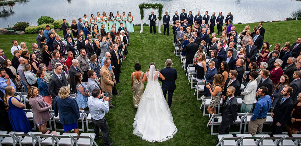 The bride walking down the aisle. This is a must have wedding photo for the shot list.