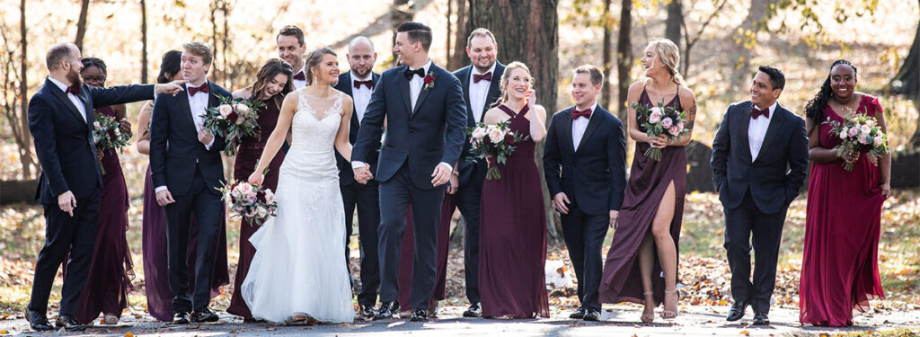 The bridal party walking together after the wedding.