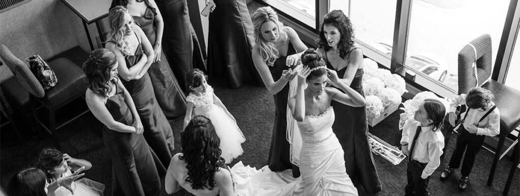 The bride getting her dress on. Another important photo that should be on your wedding photography shot list.