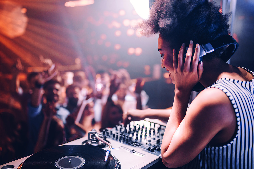 A DJ playing 90s songs at a wedding dance party