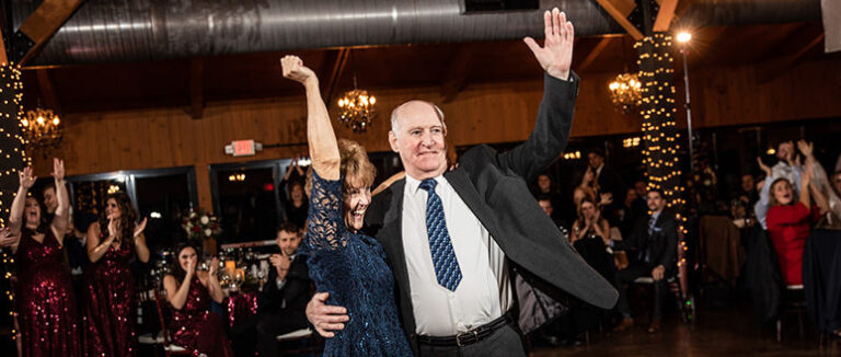 The last married couple on the dance floor after the anniversary dance at a wedding.