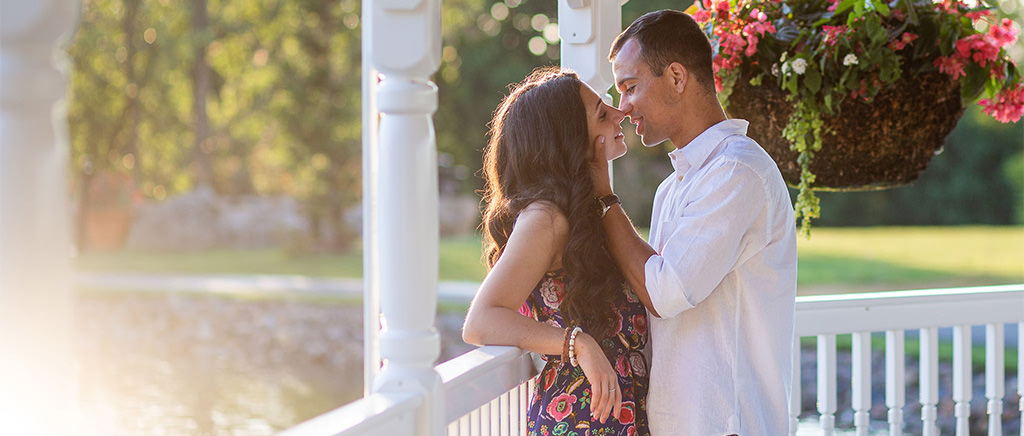 A man and a woman kissing right after getting engaged.
