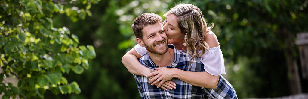 A girl kissing a guy on the cheek. This is for the article called Love Songs For Her.