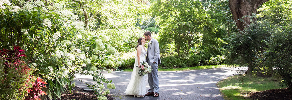 A bride and groom kissing after being married.