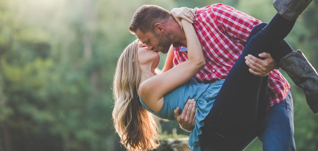 A man dipping a girl while kissing her. for the article called love songs for her.