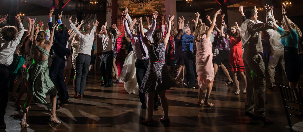 Guest doing the Y.M.C.A dance at a wedding reception. This is for the article called wedding line dance songs for groups.