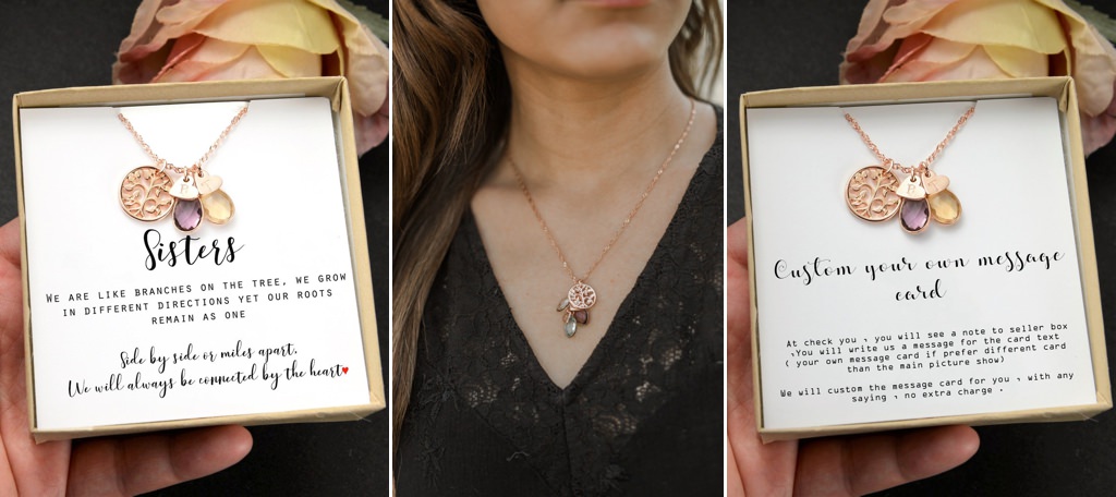 A custom designed necklace that says sisters on it.