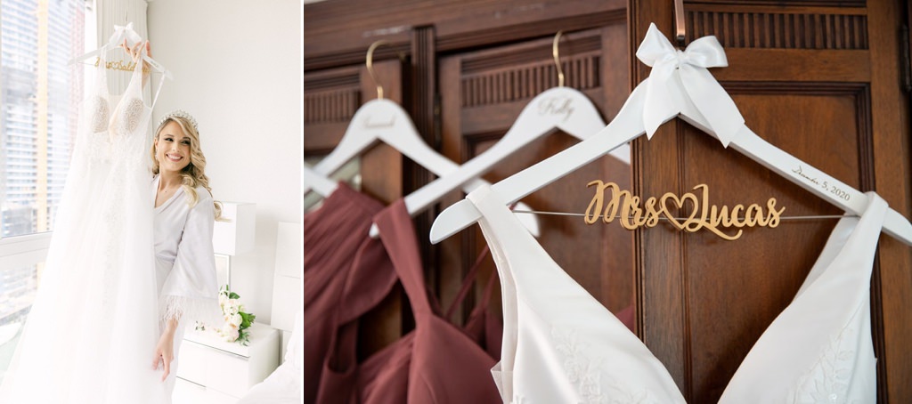 A bride holding up her wedding dress on a personalized hanger. This is for the article called best wedding gifts for sister.