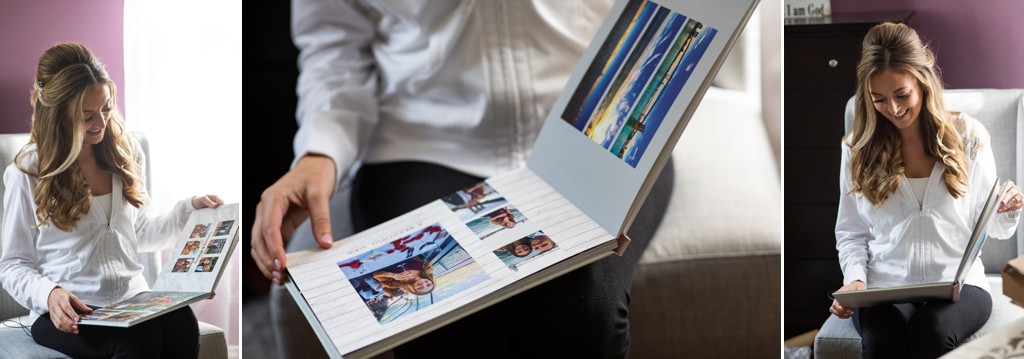 A bride looking a photo book that her sister and bridesmaids made for her.