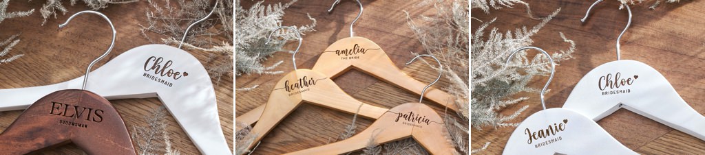 wooden bridesmaid dress hangers on a table