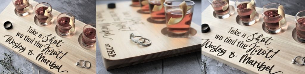 A shot board that is personalized with the name of the couple getting married.