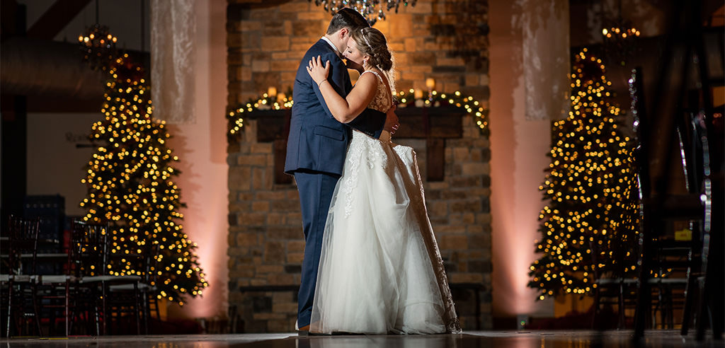 A bride and groom dancing their first dance to a romantic Disney love song.