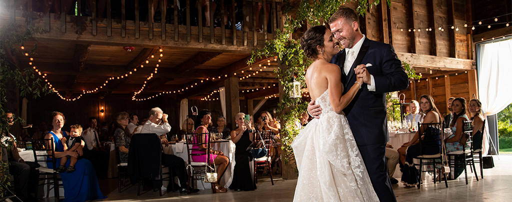 A bride and groom dancing their first dance. This is for the articles called wedding reception order of events.