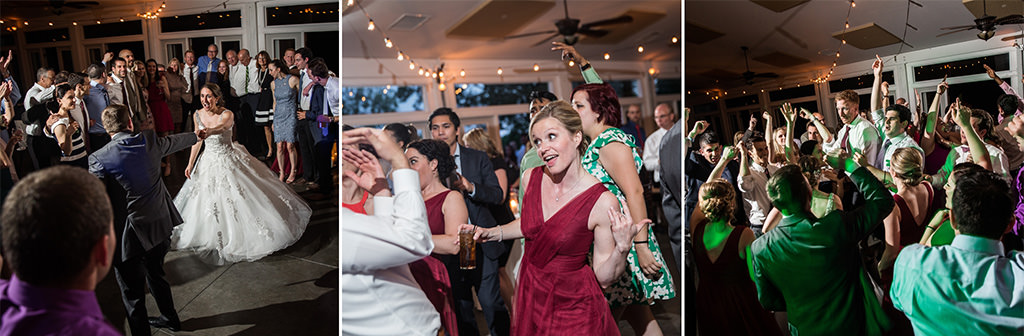 A fun wedding party reception. Many guest dancing on the dance floor.