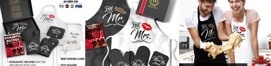 A bride and groom wearing matching his and her aprons and oven mits