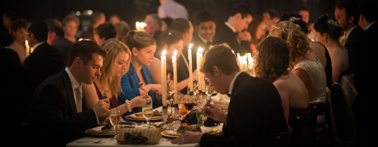 A candlelit dinner at a wedding reception. This is the cover image for the article called best wedding dinner music.