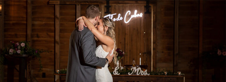 A bride and groom dancing to an acoustic song. This is the cover image for the articles called best acoustic wedding songs