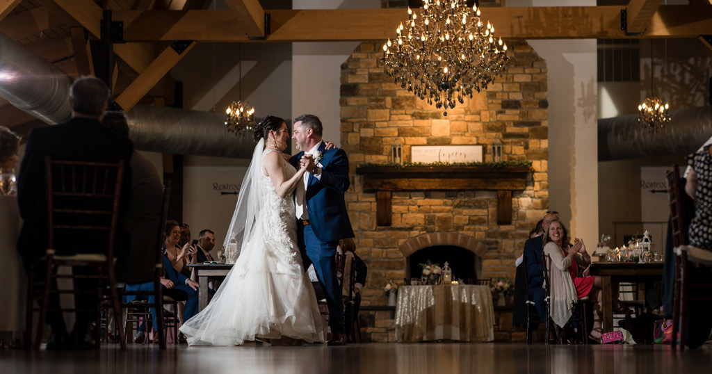 A bride and groom dancing their first dance to a special song on the wedding day.
