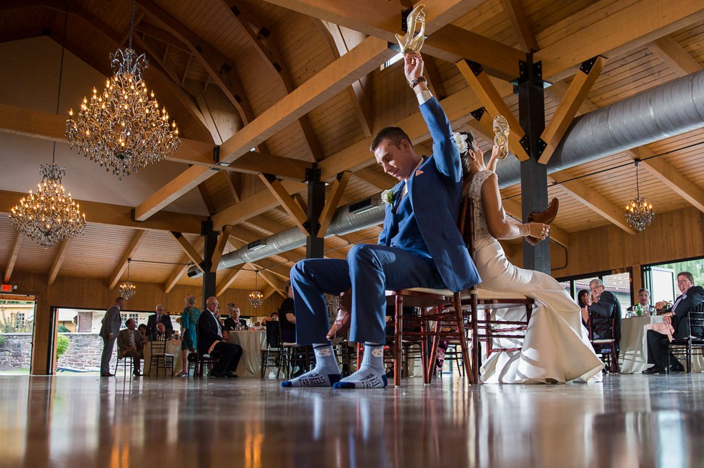 A bride and groom playing the newlywed game at their wedding reception.