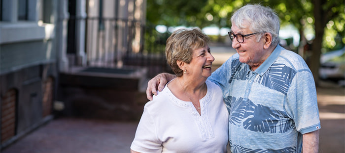 A cute older couple smiling. This is the cover photo for the article called love songs about growing old together