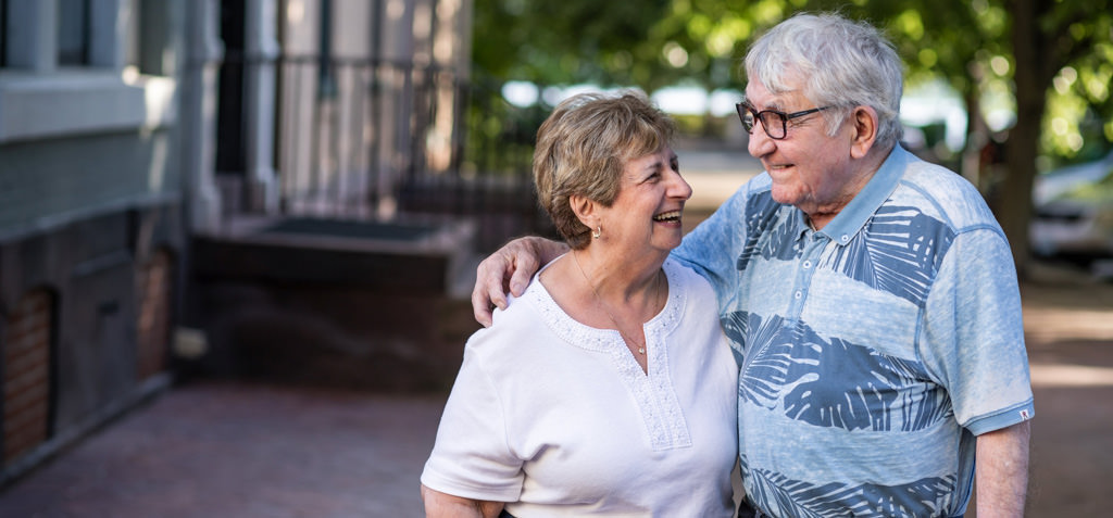 A cute older couple smiling at each other. This is for the article called love songs about growing old together.