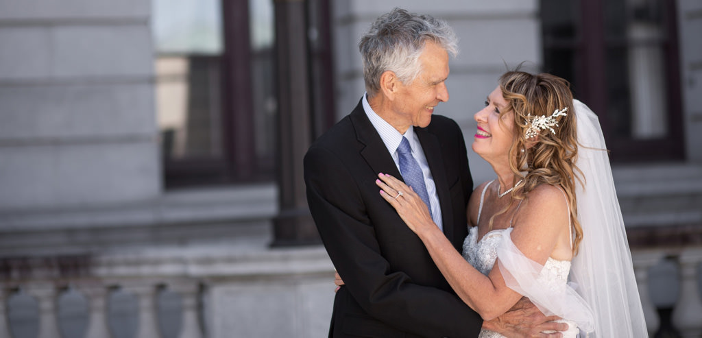A man and woman renewing their marriage vows 30 years after their wedding.