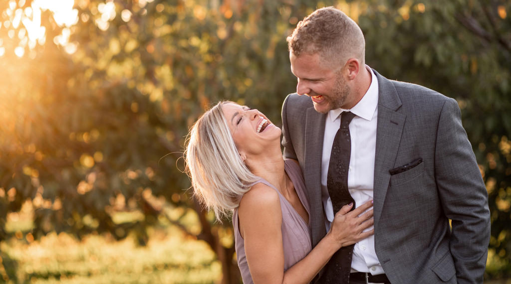 A couple smiling and laughing together