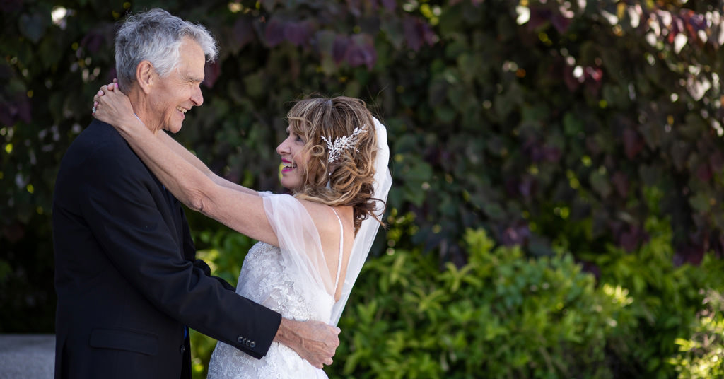 An older couple renewing their wedding vows.