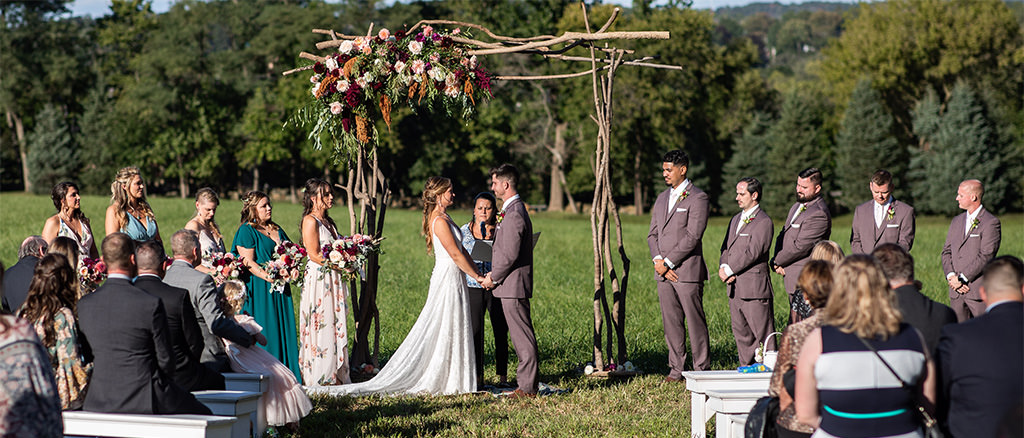 An eco-friendly, green wedding taking place in a field