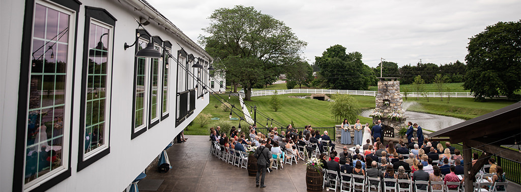 A wedding ceremony outside. This is for the article calles questions you should ask your wedding venue before booking. Printable PDF