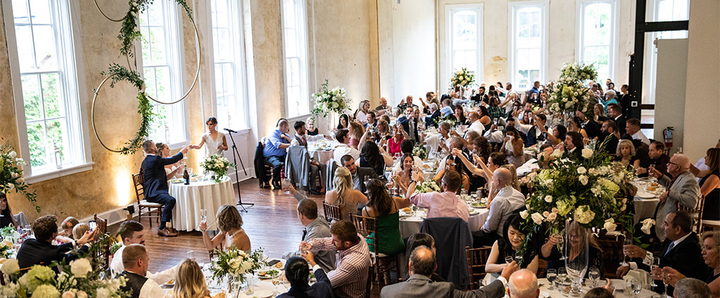 A wedding reception taking place at a gorgeous wedding venue.