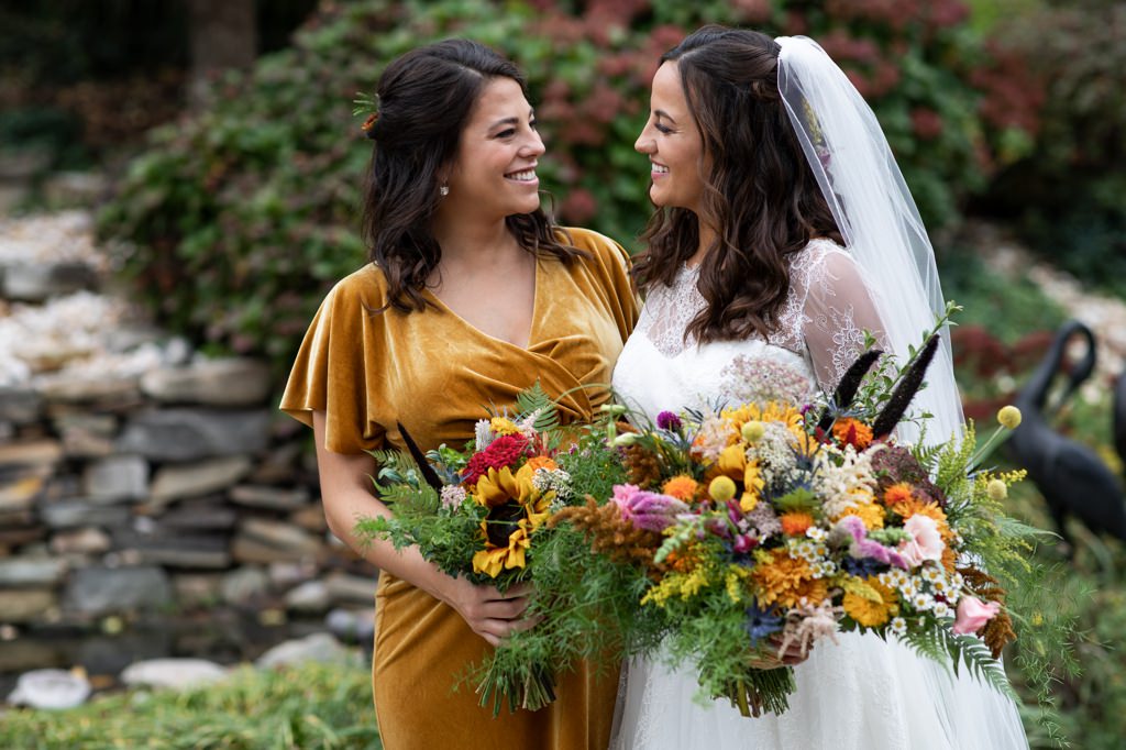 A Maid of Honor looking at the beautiful bride