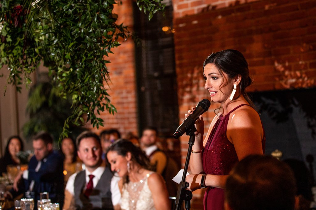 A Maid of Honor giving her speech to the newlyweds.