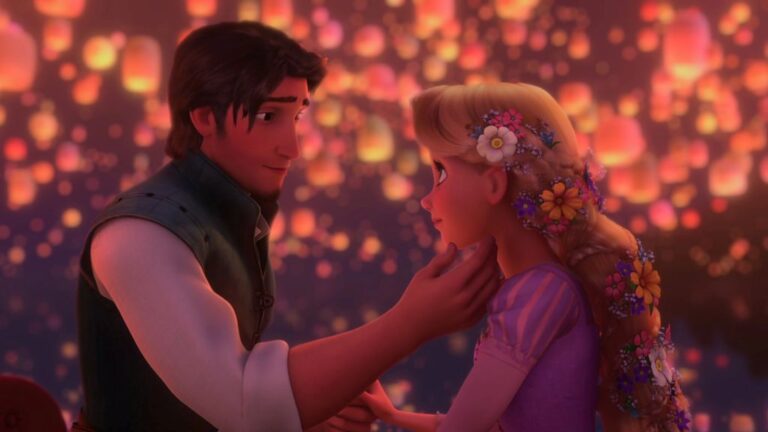 A Disney couple smiling at each other