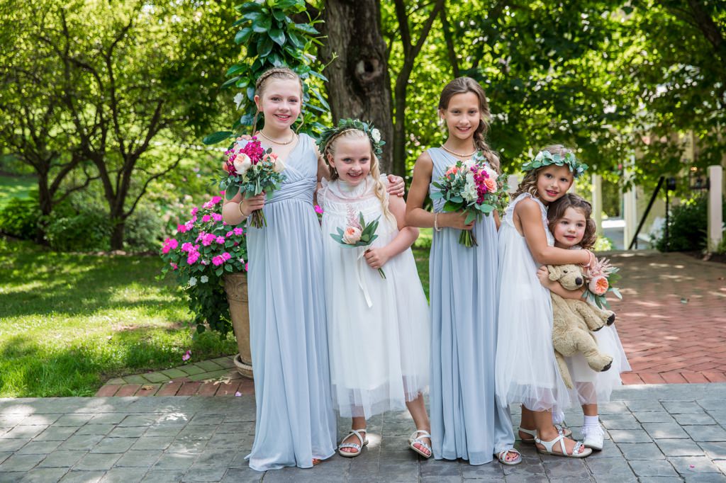 A group of kids posing at a wedding
