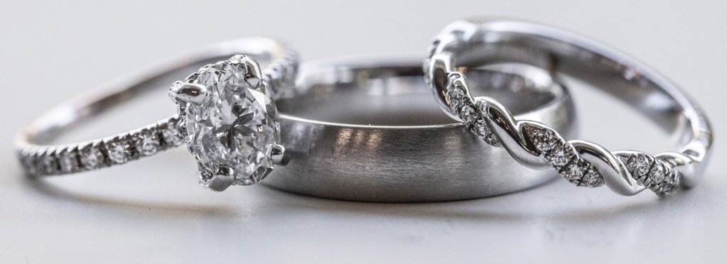 Two wedding bands and an engagement ring
