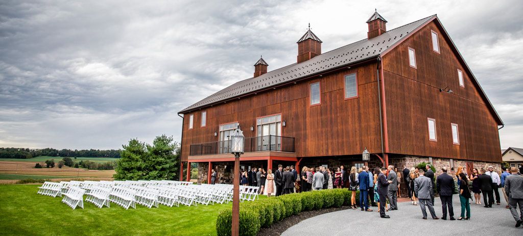 A wedding venue with guests arriving.