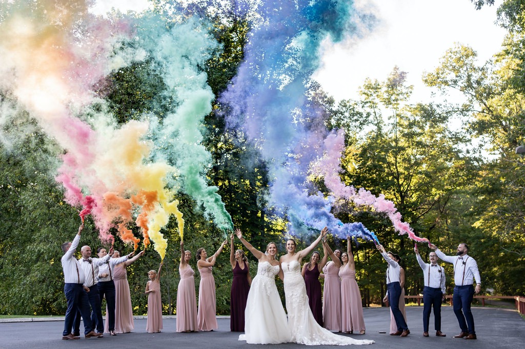 A wedding party using colored smoke